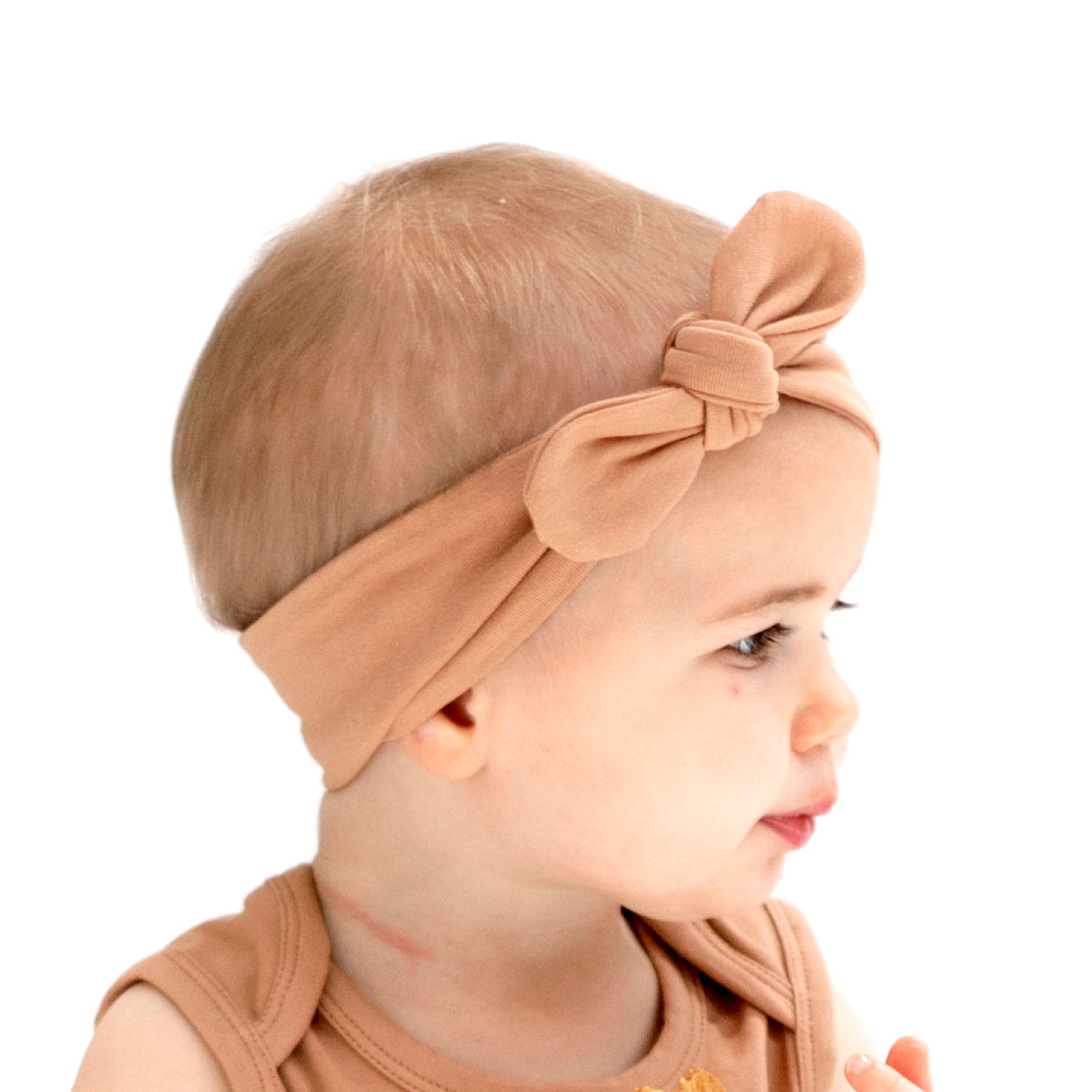 Baby girl wearing Sleeveless Bodysuit and Essential Baby Headband in Tawny Brown, designed by Burrow and Be
