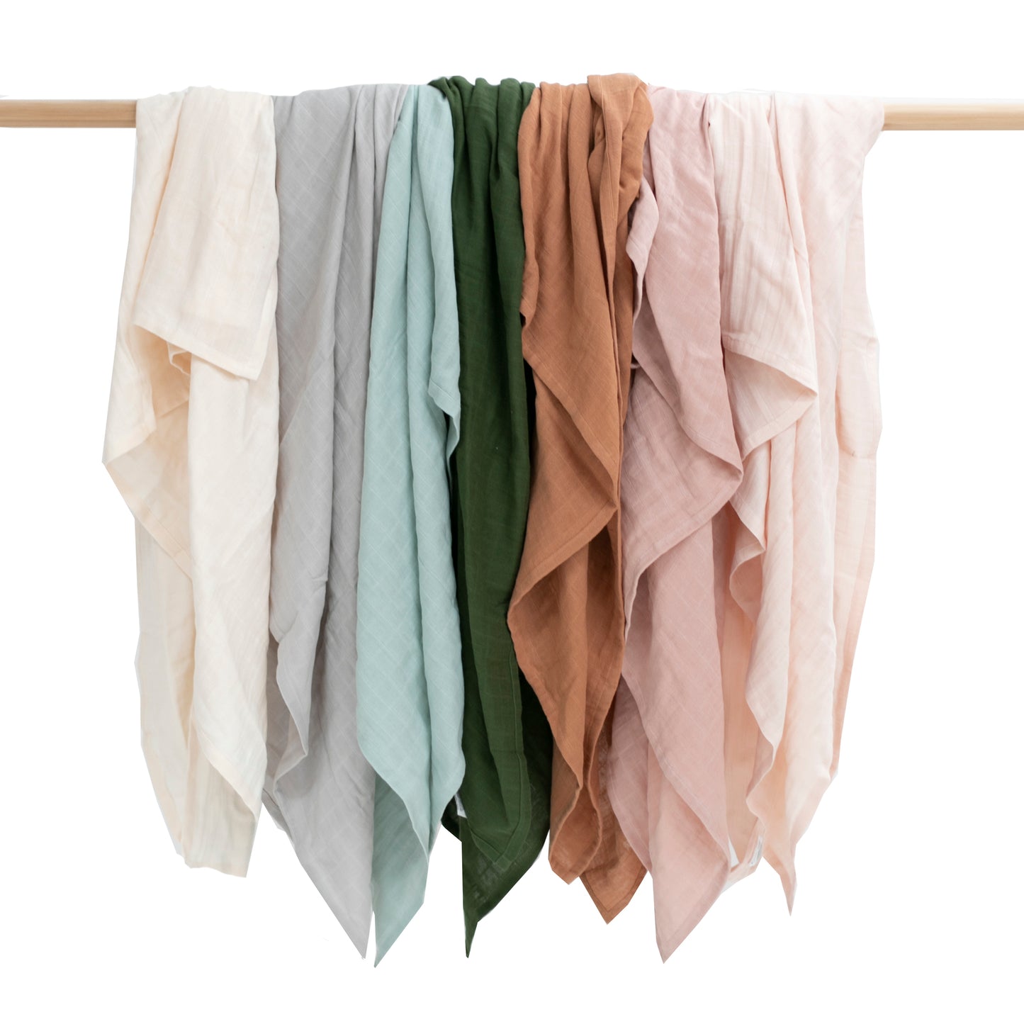 Multiple colored muslin wraps all design by Burrow and Be