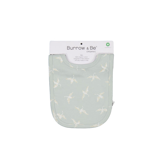 Swan Flight Snuggle Bib by Burrow and Be in its packaging