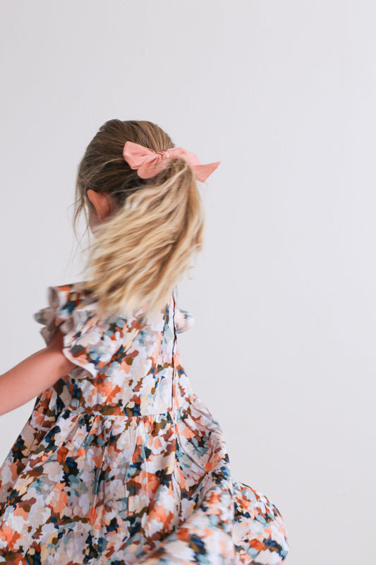 Girl wearing Burrow and Be's airy Delight Dress spinning freely