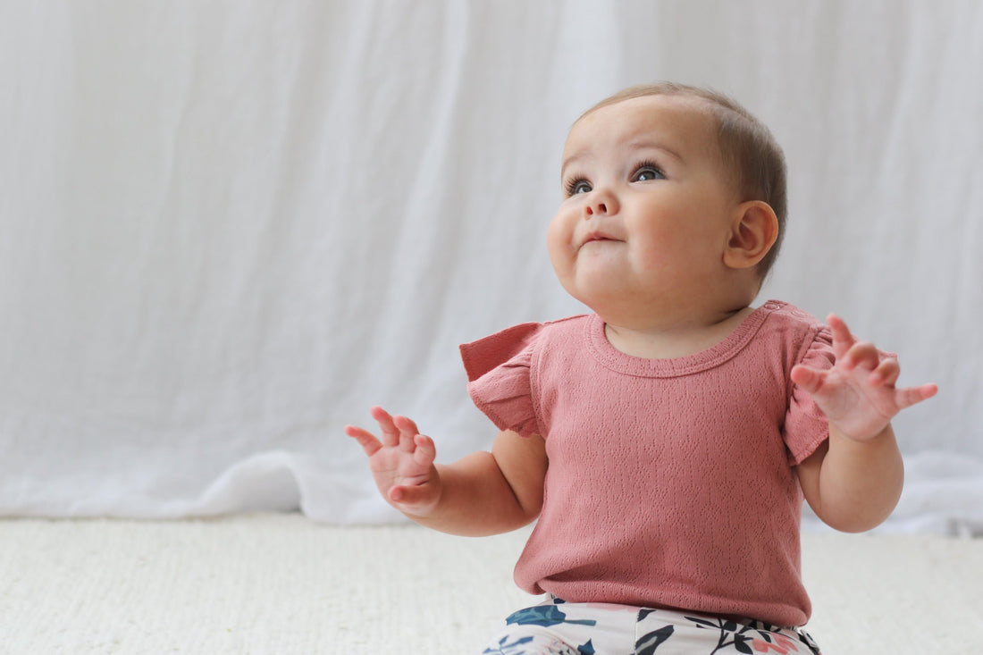Baby in lightweight organic cotton outfit perfect for Singapore's warm summer weather