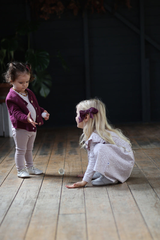 Two sisters in organic cotton, the younger wearing pieces kept from the elder, Burrow and Be Singapore