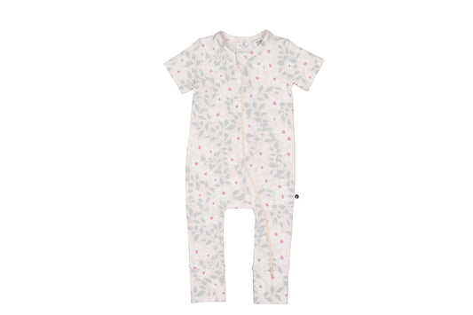 White baby onesie with small patterns on a white background