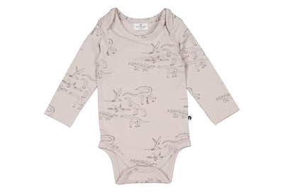 Baby onesie with dinosaur print on a white background