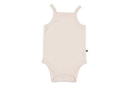 Beige baby romper on a white background