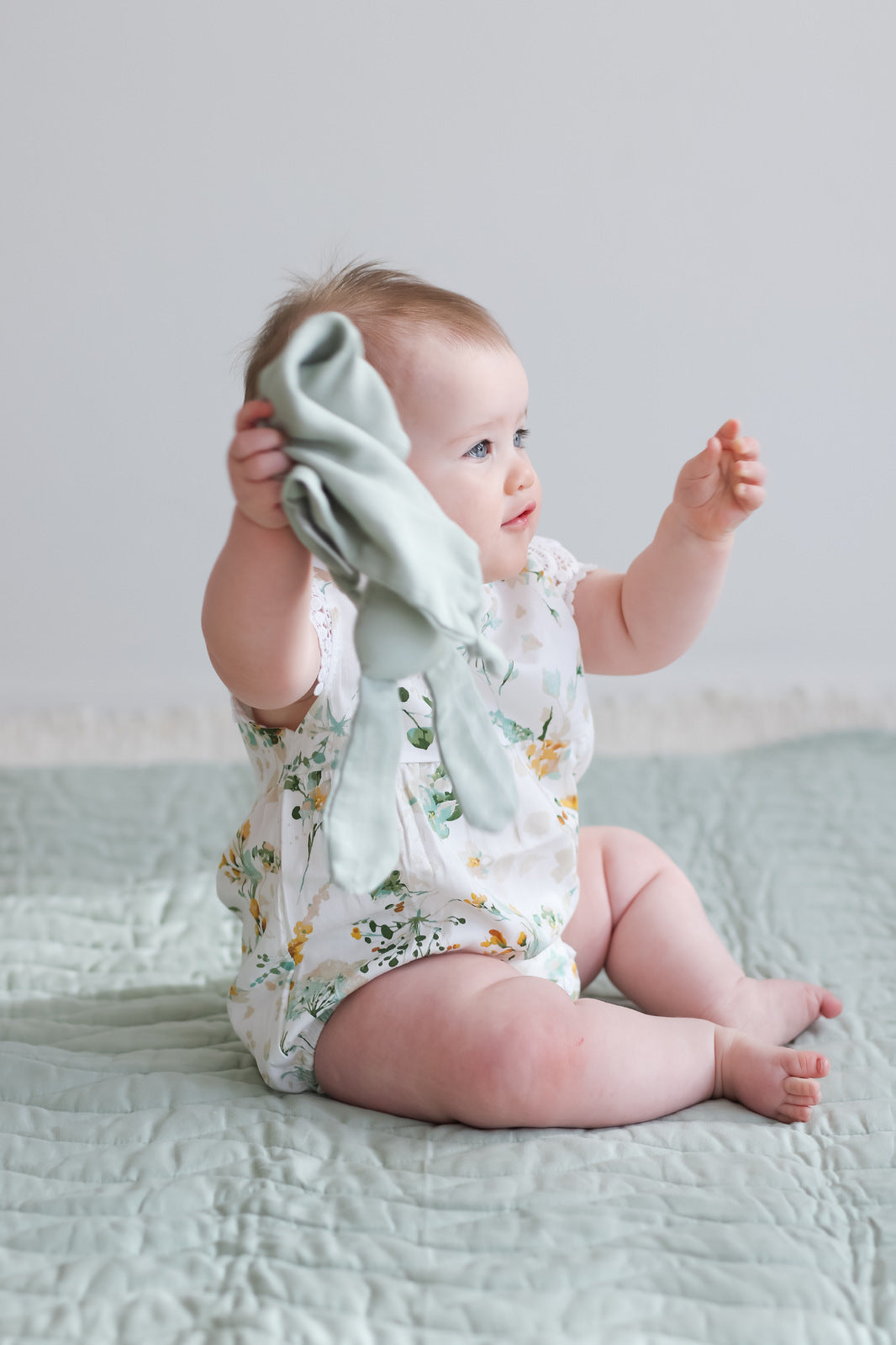 Baby in Burrow and Be Spring Melody Lace Sleeve Milly Romper holding Snuggle Bunny