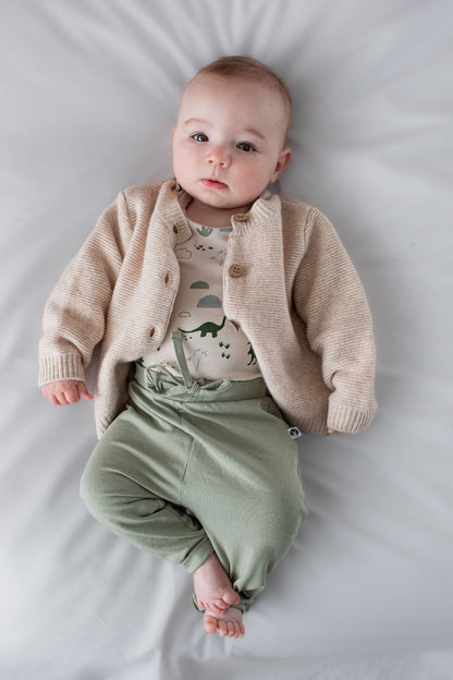 Baby wearing 100% Wool Cardigan Ecru by Burrow and Be