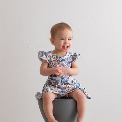 Eden Flutter Baby Dress by Burrow and Be featuring foliage and hidden bunny print