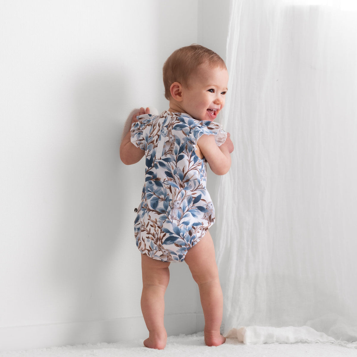 Eden Flutter Bubble Romper by Burrow and Be featuring foliage and hidden bunny print