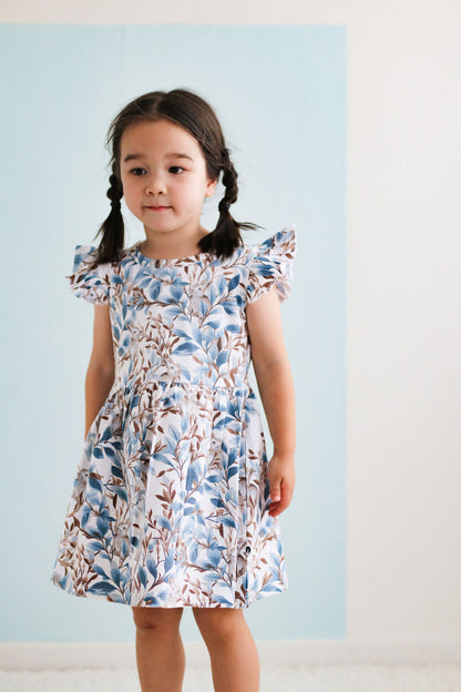 Eden Flutter Dress by Burrow and Be side view showing flutter sleeve detail
