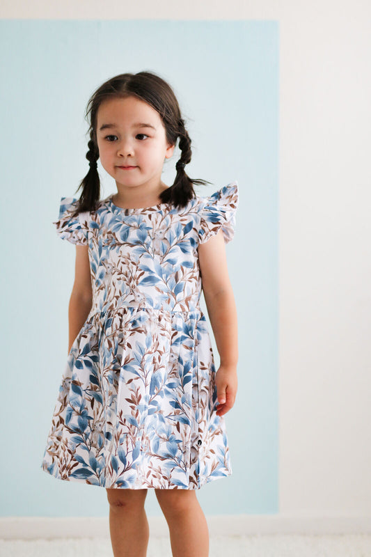 Eden Flutter Dress by Burrow and Be side view showing flutter sleeve detail