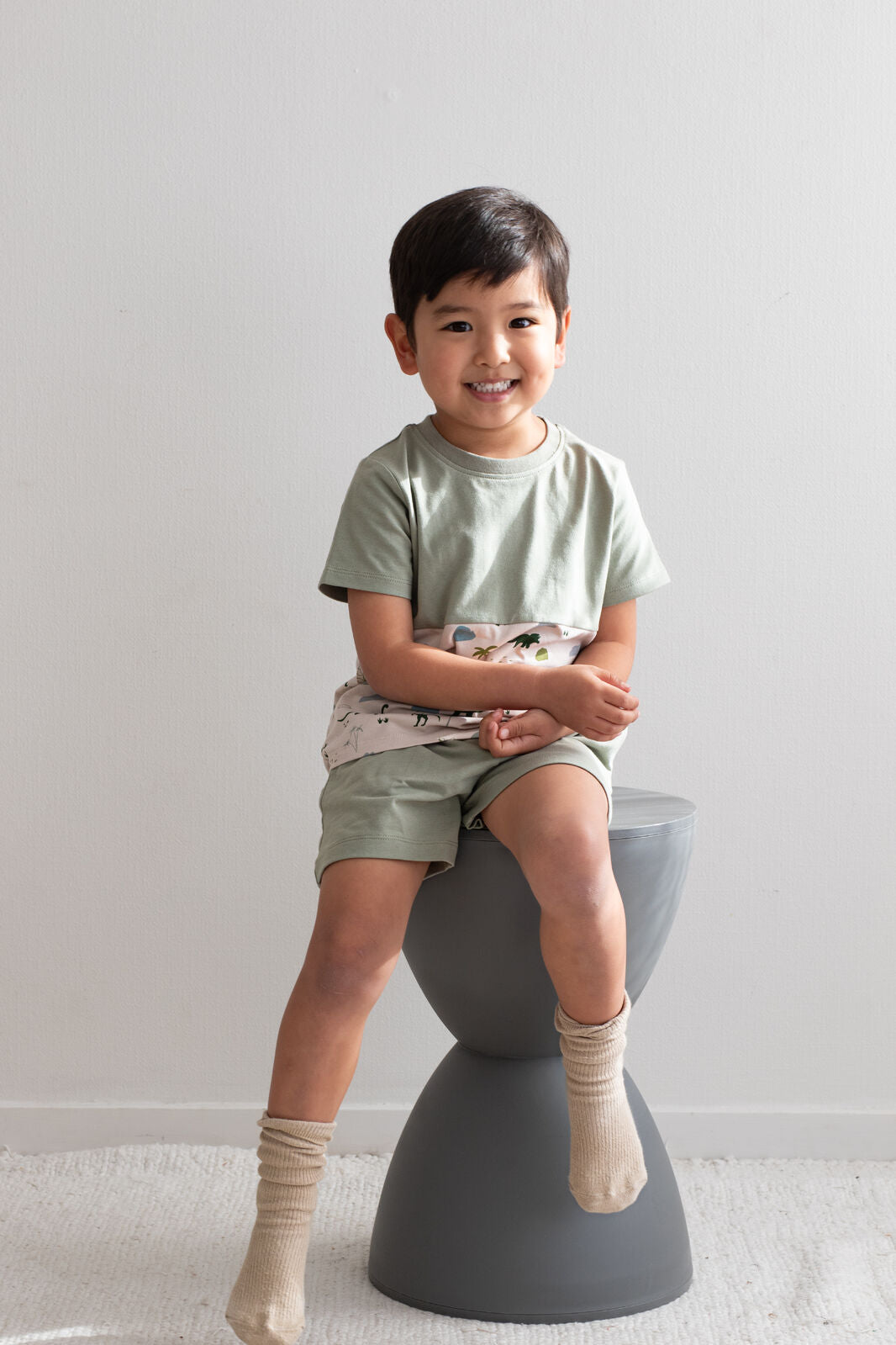 Boy wearing Jurassic Roam Block T-Shirt by Burrow and Be