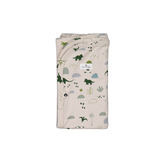 Jurassic Roam Stretchy Swaddle by Burrow and Be featuring earthy dinosaur print