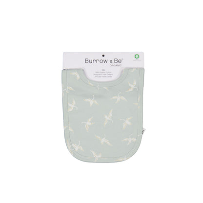 Swan Flight Snuggle Bib by Burrow and Be in its packaging