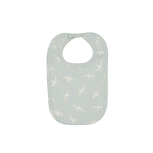 Swan Flight Snuggle Bib by Burrow and Be featuring white swans on sage