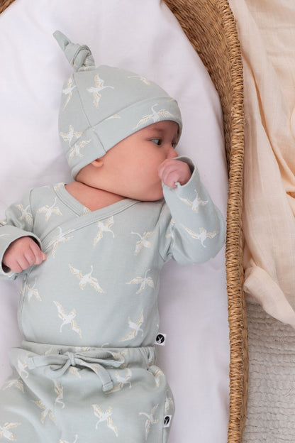 Baby wearing Swan Flight Long Sleeve Kimono Bodysuit by Burrow and Be